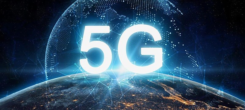 Bright 5G text overlaying Earth with glowing network connections, symbolizing global advancements in high-speed IoT connectivity and communication technologies